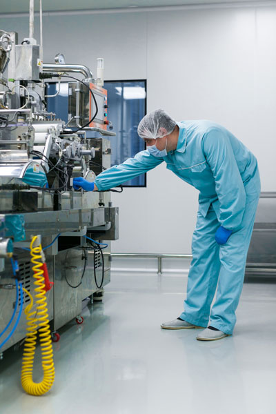 vertical-picture-bended-caucasian-scientist-blue-lab-suit-trying-fix-manufacture-machine-with-shafts-clean-factory Vertical picture bended caucasian scientist blue lab suit trying fix manufacture machine with shafts clean factory